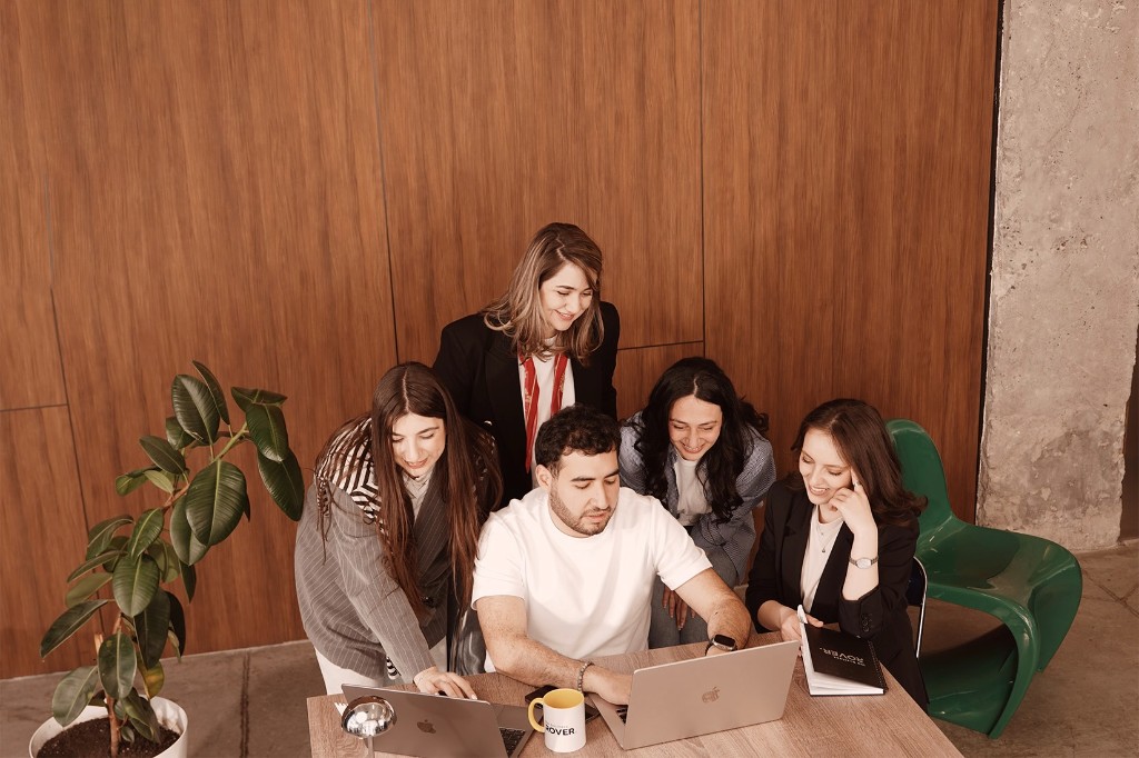 SEO consultants collaborating during a strategy session at The Business Rover